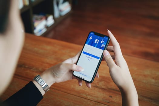 Chiang Mai Thailand. JUN 29, 2022. Woman holds smart phone with facebook application on the screen. facebook is a photo-sharing app for smartphones.