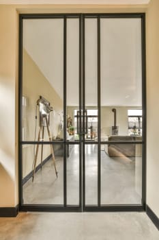 the inside of a house with glass doors that are open and there is an empty living room in the background