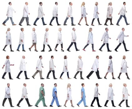 group of doctors in motion isolated on white background