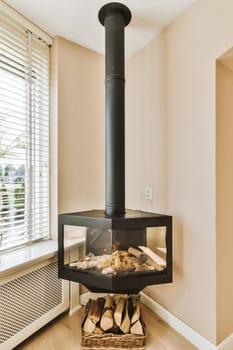 a wood burning stove in the corner of a room next to a window with shutters and blinds on it