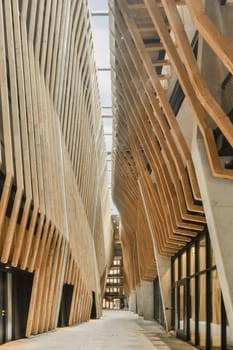 the inside of a building that is made out of wooden planks and has been used as an art installation