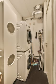 a washer and dryer in a small room with no one on the wall or floor to be used