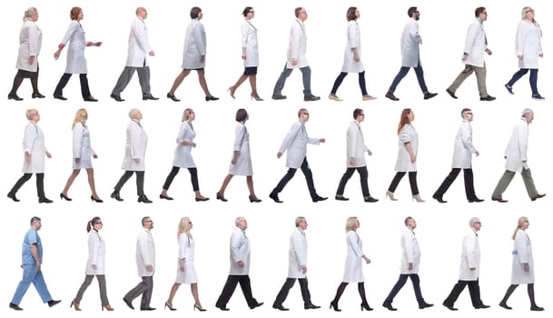 group of doctors in motion isolated on white background