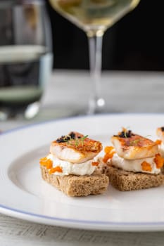 Red mullet with mash sauce on slices of bread in fine dining restaurant