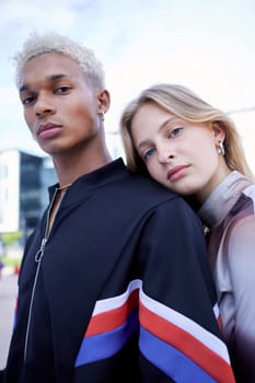 Fashion, youth and portrait of couple in city pose for selfie wearing trendy, stylish and cool clothes. Diversity, freedom and fashion design students on weekend in urban town with serious face.