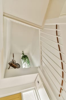 a room with white walls and wood trim on the ceiling, showing how it's going to look like an attic