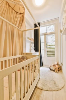 a baby's room with a cribt and teddy bear on the floor next to the cribt