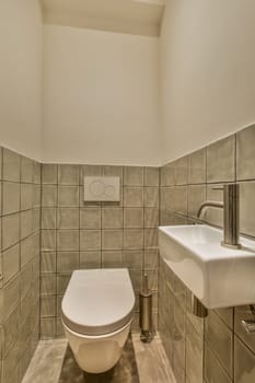 a bathroom with a toilet, sink and mirror on the wall in it's corner to the left side