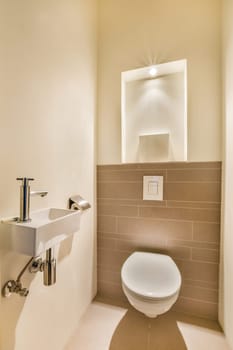 a bathroom with a sink and mirror above the toilet bowl that is not in use, but it's very clean