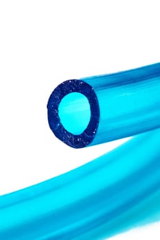 Blue plastic tube isolated on white background close up