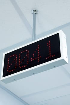 Electronic display with a red number in the service center