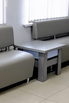 Sofas and tables in the waiting room close up