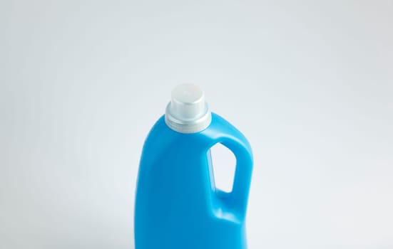 Blue plastic liquid detergent bottle isolated on white background. Laundry container, merchandise template. Product design. Mock up