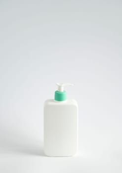 Blank body cream, lotion, shampoo or shower gel bottle photo. White plastic container isolated on white background