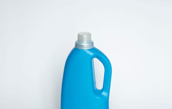 Softener in blue plastic bottle isolated on white background. Bottle with liquid laundry detergent, cleaning agent, bleach or fabric softener. Product design. Mock up