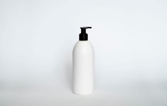 White liquid container for shampoo, gel, lotion, cream, bath foam etc. Blank unbranded cosmetic plastic bottle with black dispenser pump