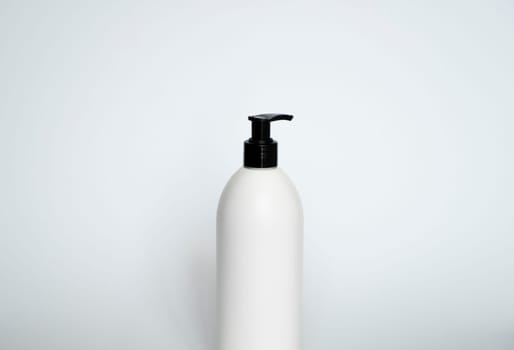 Liquid container for gel, lotion, cream, shampoo, bath foam. Cosmetic plastic bottle with black dispenser pump