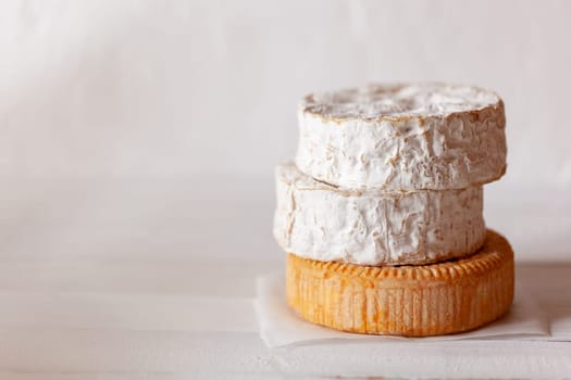 stack of soft french goat cheese camembert style