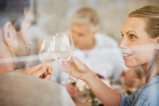 Couple, smile and champagne toast at dinner celebrating in home. Cheers, love and man, woman and sparkling golden wine or alcohol, beverage or drink celebration at party, event or family gathering