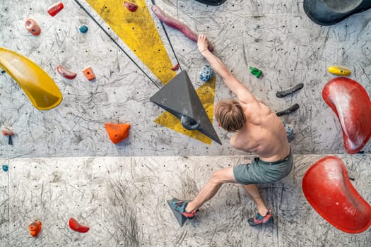 bouldering on an artificial climbing wall. High quality photo