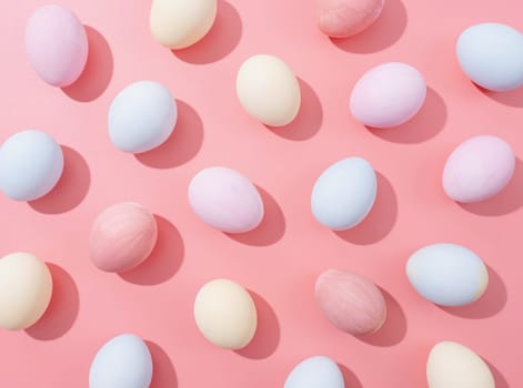 Spring holidays, Happpy Easter. pastel colored easter eggs with hard shadows pattern on pink background