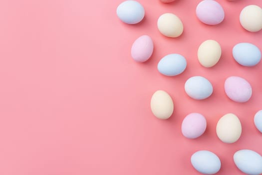 Spring holidays, Happpy Easter. pastel colored easter eggs pattern on pink background