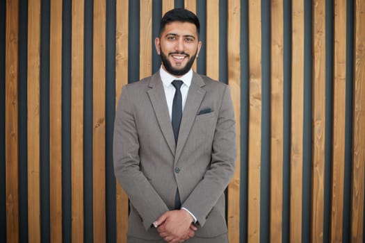 successful businessman on the background of a modern office.