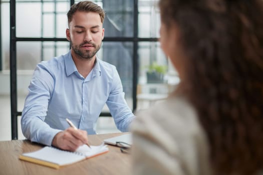 Handsome bearded man in a modern office