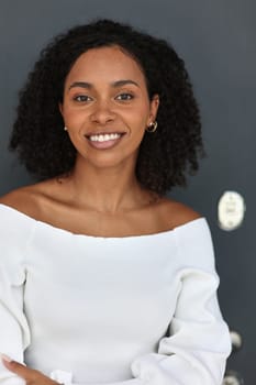 Beautiful female african american business woman CEO in a suit at the workplace