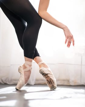 Close-up of the legs and arms of a ballerina