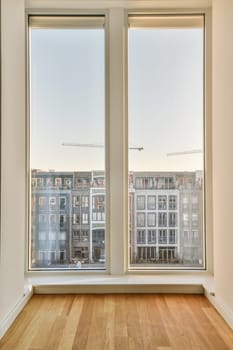 an empty room with wooden floors and large windows looking out onto the cityscapearl view from inside