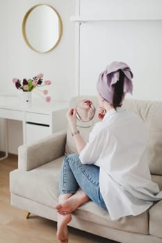 Good morning, smiling young woman in a cozy room at home