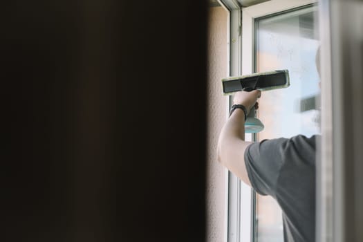 washing and cleaning window at home. Housework and housekeeping, home hygiene