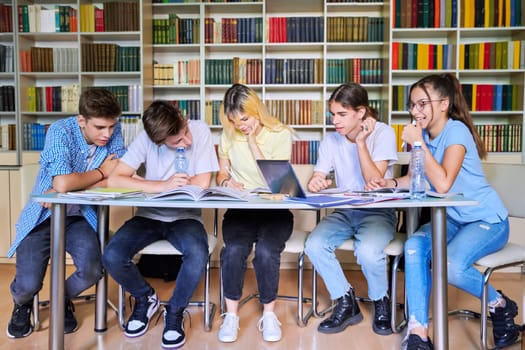 Group of teenage students study in library class. High school, education, adolescent, back to school, back to college concept