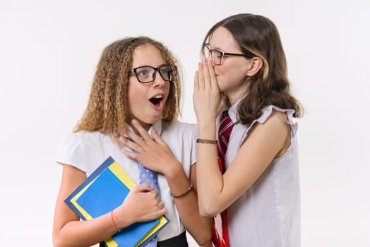 Happy high school friends teenage girls, talk and secret, with books and notebooks on white background