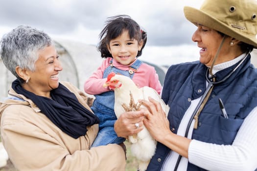 Agriculture, farm and grandparents with girl and chicken for farming, veterinary and agro industry. Sustainability, countryside and happy child with family for protein, animal produce and livestock.