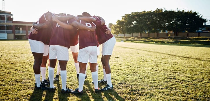 Men, huddle and team on grass field for sports motivation, coordination or collaboration for goal. Group of sport athletes in fitness training, planning strategy in solidarity and support of game.