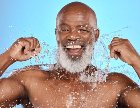 Black man, water splash and flossing teeth for dental health, hygiene and wellness on blue studio background. African senior model with floss cleaning mouth for dentist, water and portrait mockup.