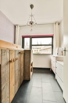 a kitchen area with wooden cabinets and white appliances on the counter top, and purple walls in the back wall