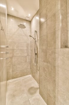 a walk in shower that is clean and ready to be used for the next day's washrooms