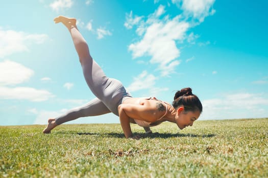Meditation, energy and woman doing yoga on a field for zen, fitness and exercise in nature. Pilates, wellness and sports lady plank, training and practicing posture, strength and balance handstand.