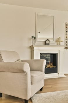 a living room with a fireplace in the center and a mirror on the wall over the couch is next to the fire place