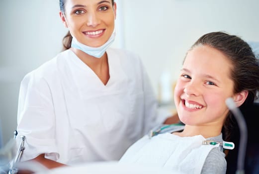 Most kids dont like the dentist but I do. Portrait of a young girl have a checkup at the dentist