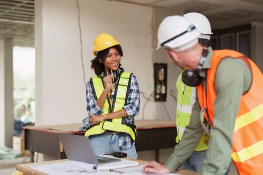 American African Foreman builder woman at construction site. Foreman construction and Engineer working at construction site.