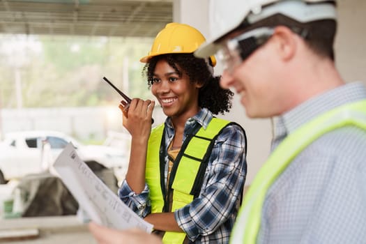 American African Foreman builder woman at construction site. Foreman construction and Engineer working at construction site.