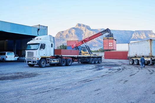 Container, logistics and truck for transport of cargo, stock or manufacturing delivery at a warehouse. Transportation of freight for distribution, shipping and ecommerce at an industrial factory.