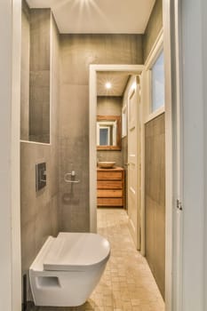 a bathroom with a toilet and sink in the corner, taken from the inside looking into the room to the outside