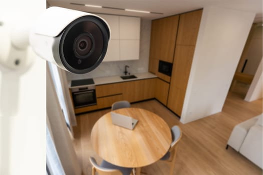 Modern CCTV camera installed in entryway of apartment building.