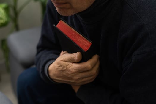 Hands of man praying to god with the bible, Concept of faith for god.