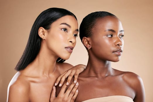 Skincare, beauty women and friends in studio for dermatology, makeup and cosmetics. Black people together for model skin inclusion, spa facial and face glow for wellness on a brown background.